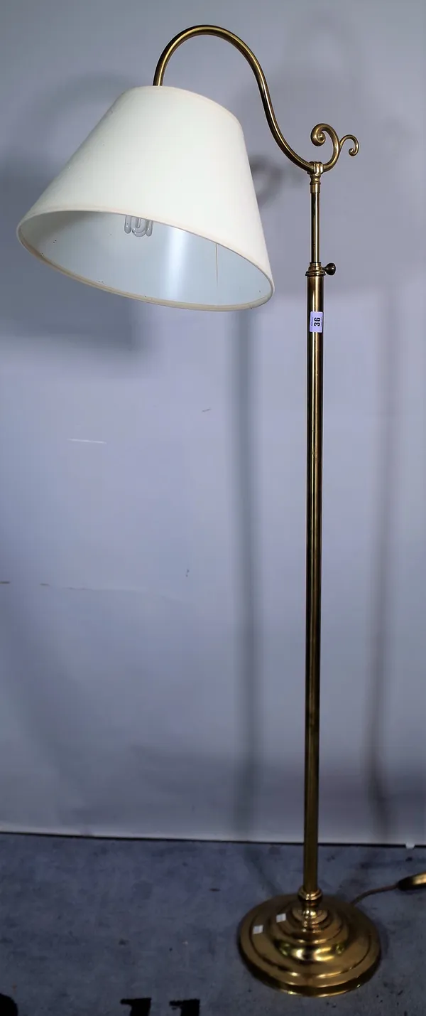 A 20th century brass adjustable standard lamp on plinth base, 156cm high.
