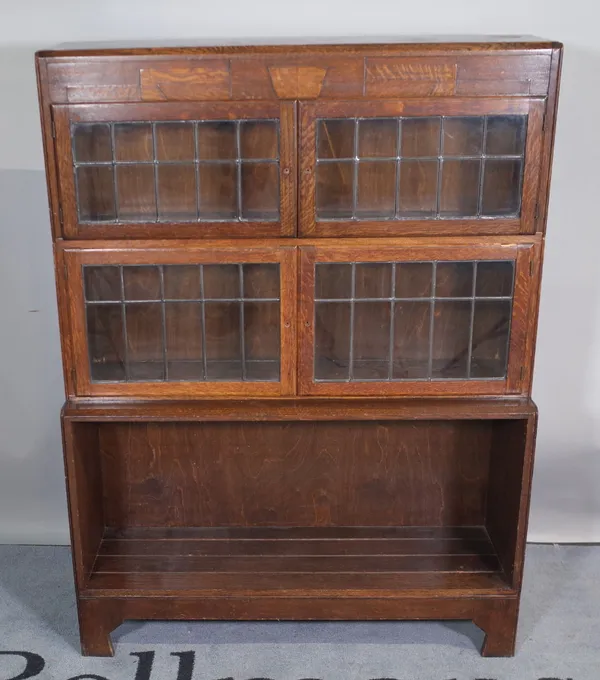 A mid-20th century Art Deco oak three tier Globe Wernicke, 89cm wide x 119cm high.