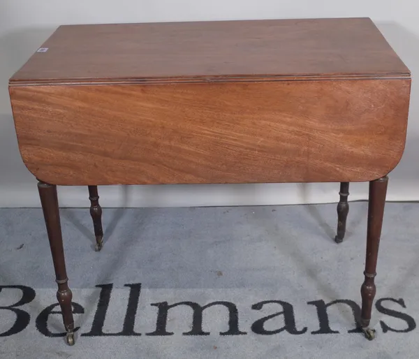 A Regency mahogany single drawer Pembroke table, on tapering ring turned supports, 86cm wide x 72cm high.