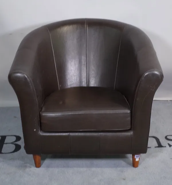 A 20th century tub back club chair on tapering turned supports, 80cm wide x 74cm high.