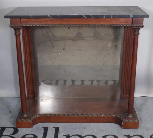 An Empire style mahogany console table with mirrored back and faux marble top, 94cm wide x 87cm high.