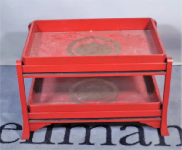 A 20th century red lacquer two tier side table with two butlers trays, 68cm wide x 49cm high.  Provenance; property from the late Sir David Tang This