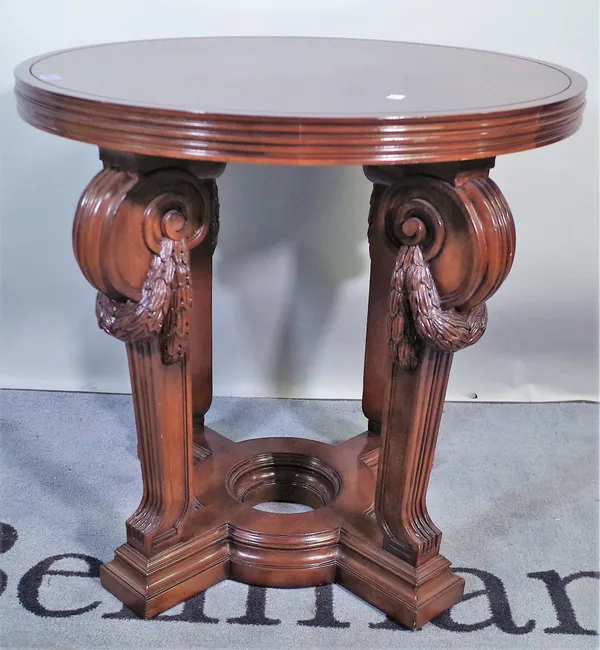 Ralph Lauren; a Regency style mahogany centre table on four downswept swag carved supports, 73cm wide x 72cm high.