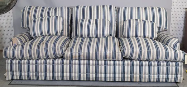 A 20th century three seat sofa with blue and white striped upholstery on tapering supports, 216cm long x 68cm high, and two matching low chairs, (3).