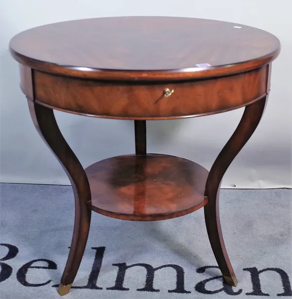 Ralph Lauren; a 20th century mahogany circular centre table with single drawer on three downswept supports, 76cm wide x 78cm high.