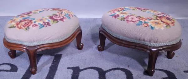 A pair of Victorian mahogany oval footstools, 35cm wide x 20cm high, another Victorian rectangular footstool, 30cm wide x 20cm high, a George III maho