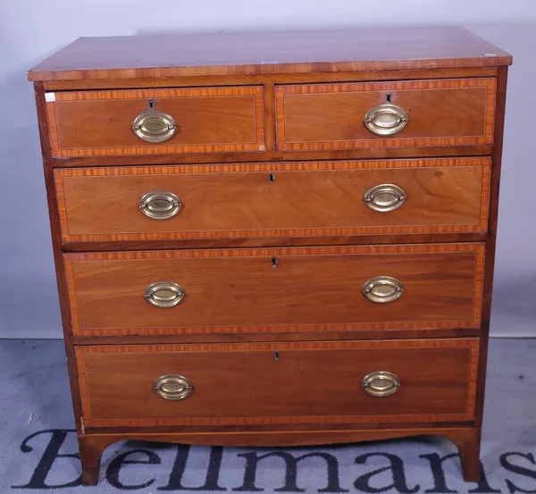 A 19th century satinwood banded mahogany desk, with two short and three long graduated drawers, 93cm wide x 98cm high.