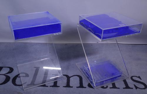 A pair of 20th century perspex side tables of 'Z' form filled with blue powder, 30cm wide x 46cm high, (one a.f.).  Provenance; property from the late