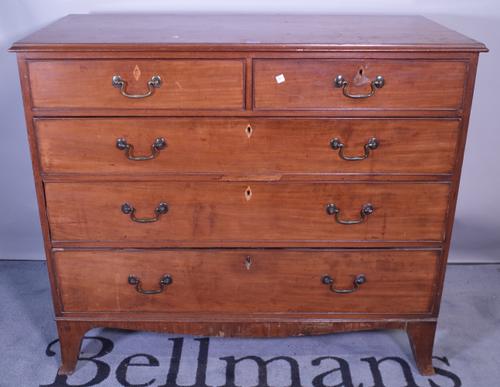 An early 19th century mahogany chest of two short and three long graduated drawers on splayed bracket feet, 113cm wide x 100cm high.