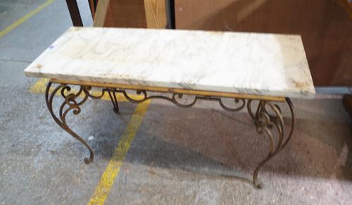 A 20th century gilt metal rectangular coffee table of scrolling form and associated marble top, 112cm wide x 58cm high.  Provenance; property from the