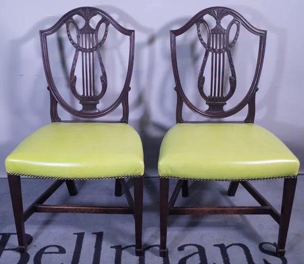 A pair of George III style mahogany shield back dining chairs and a Regency style dining chair, (3).  Provenance; property from the late Sir David Tan