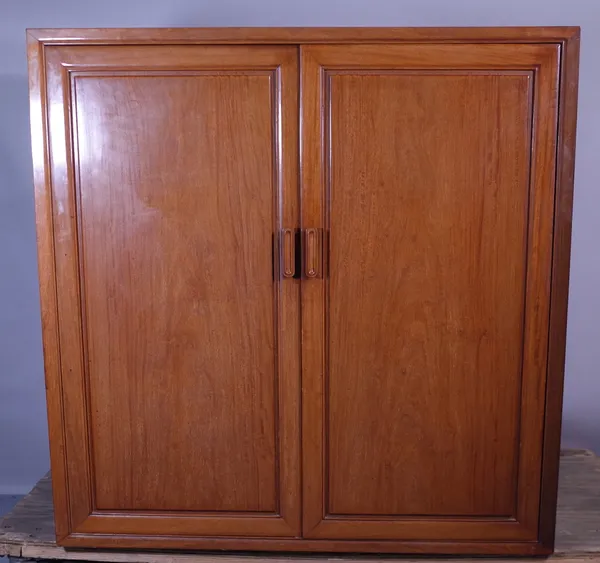 A 20th century Chinese hardwood two door cupboard, with a shelved interior, 110cm wide x 110cm high.