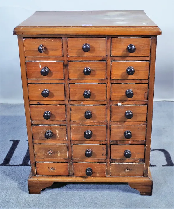 A 20th century Indian hardwood collector's chest of twenty one drawers, 45cm wide x 62cm high.