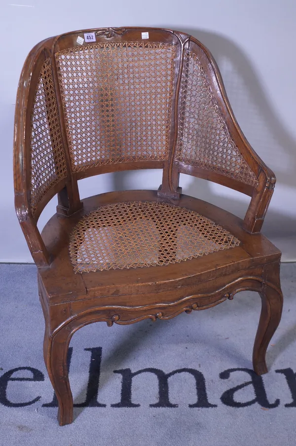 An 18th century oak Bergere chair on cabriole supports.