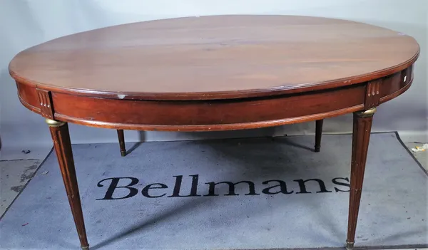 A 19th century French fruitwood oval dining table, on tapering fluted supports, 138cm wide x 168cm long.