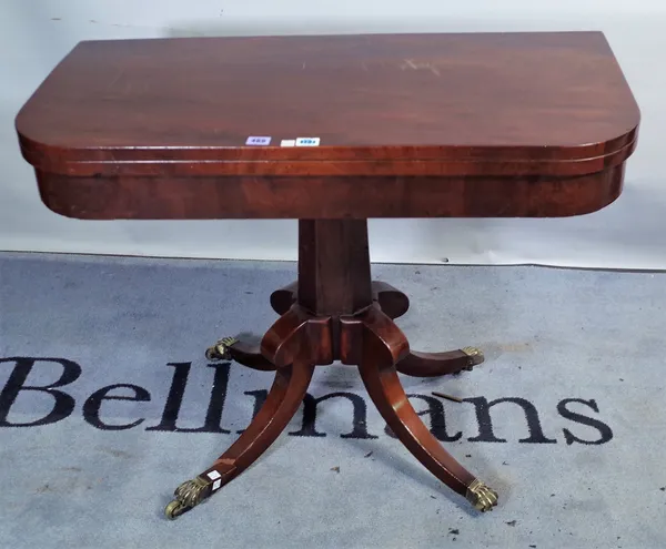 A late George III mahogany card table on octagonal column and four downswept supports, 91cm wide x 72cm high.