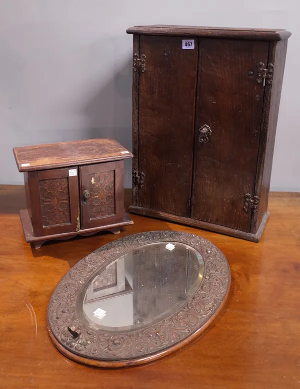 An oak two door cupboard, made from old floor boards, 39cm wide x 53cm high, a late 19th century pitch pine two door cupboard enclosing two drawers, 2