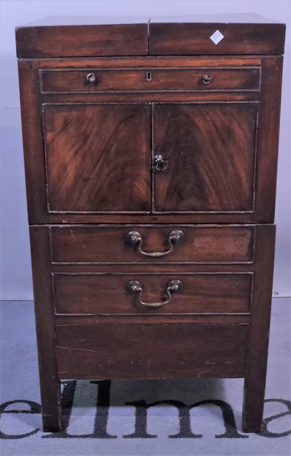 A George III mahogany washstand, with foldover top above false drawer and cupboard doors, 46cm wide x 84cm high, and a 19th century mahogany tambour f