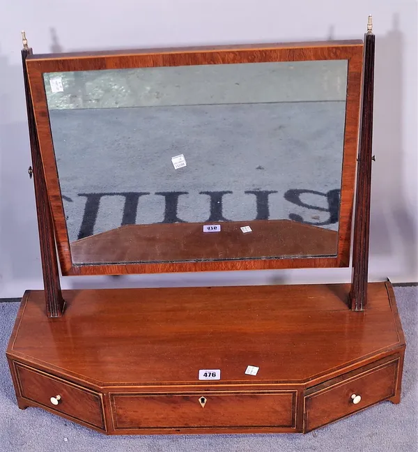 A late George III mahogany rectangular toilet mirror with an oblong banded base and three short frieze drawers on bracket feet, 61cm wide x 63cm high.