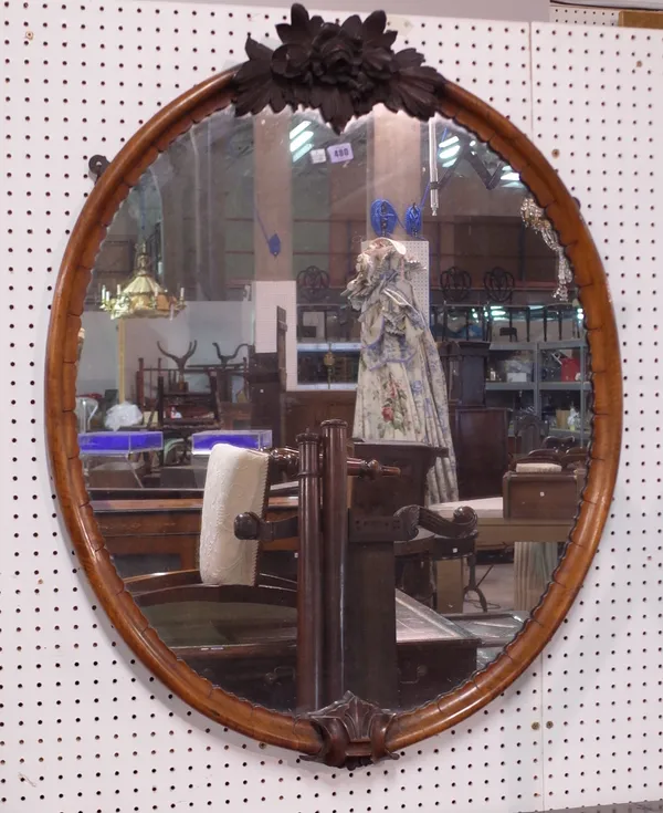 A Victorian mahogany mirror, with a shaped frame, 84cm wide x 104cm high.