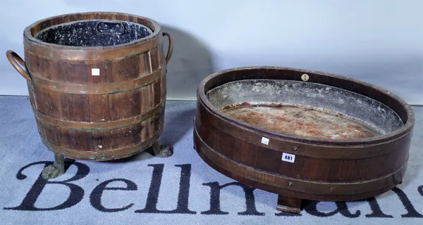 A coopered oak log basket on paw feet, 48cm diameter, together with a studded jardiniere by Lister & Co, 64cm wide, (2).