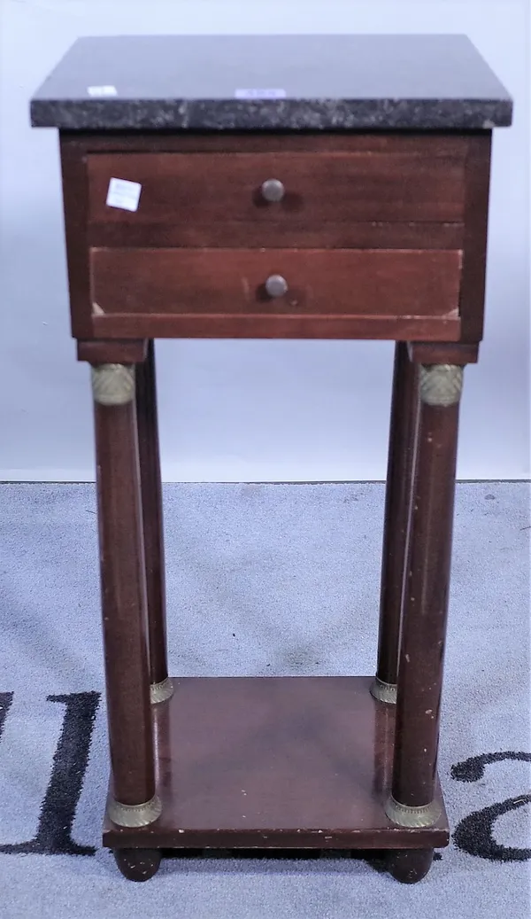 An Empire style brass mounted mahogany bedside table, with a marble top over two short drawers, on turned supports, 30cm wide x 61cm high.