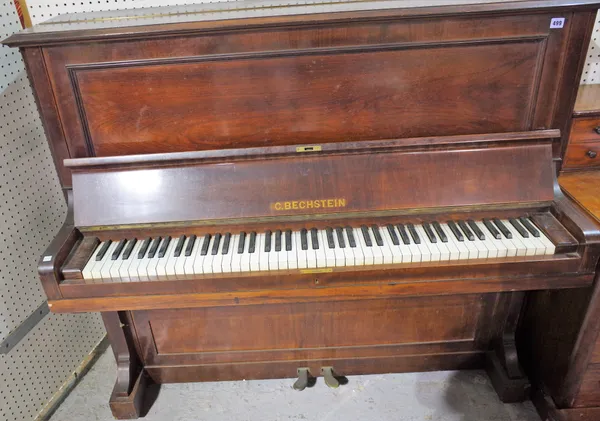 C. BECHSTEIN, BERLIN; a late 19th century rosewood cased iron framed upright piano, No 44312, 1897, 147cm wide x 128cm high x 60cm deep.