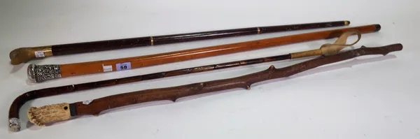 A Chinese Malacca walking cane with embossed silver pommel, 89cm, a bamboo riding crop, two further walking sticks and a pair of 1930s onyx bookends m