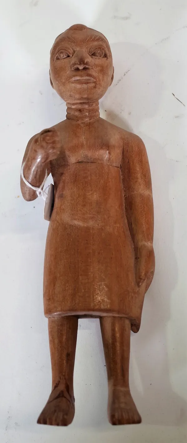 An Osei Bonsu carved Ashanti tribal wooden figure of a female native, (a.f.), 25.5cm high.