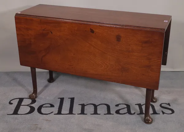 An 18th century mahogany drop flap table, on turned tapering supports and pad feet 106cm wide x 70cm high.