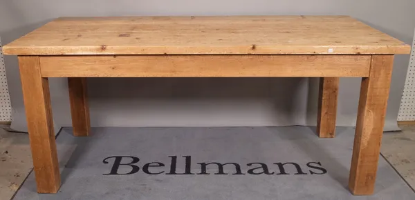 A 20th century rectangular pine kitchen table, on block supports, 178cm wide x 80cm high.