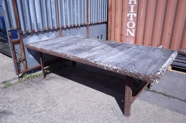 An early 20th century large riveted iron and oak plank garden table, 285cm long x 132cm wide.