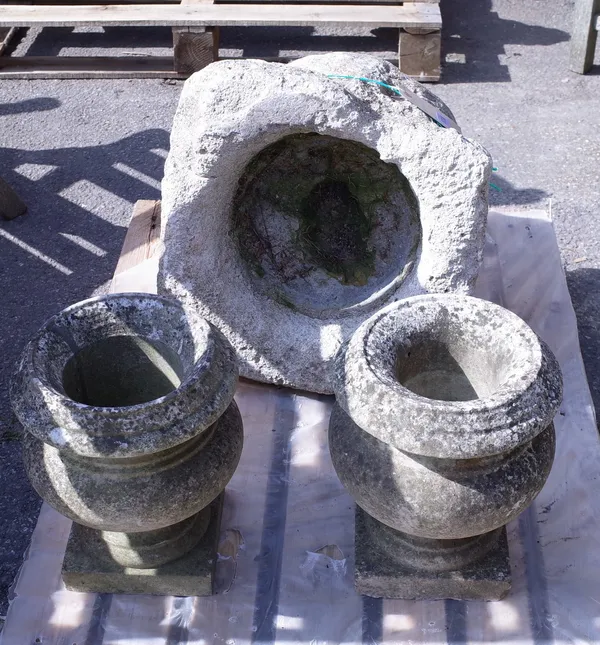 A pair of early 20th century carved white marble urns, 33cm high, and an early 20th century stone mortar, 44cm wide x 50cm high, (3).