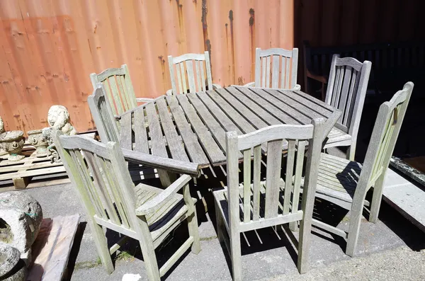 Barlow Fry Tyrie; a set of eight 20th century hardwood garden chairs, to include; four open armchairs and a 20th century hardwood octagonal garden tab