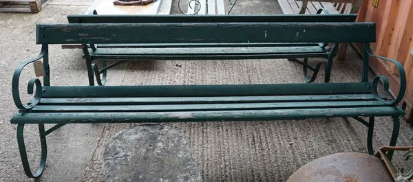 A 20th century green painted wrought iron strapwork garden bench, 214cm wide x 73cm high, and another similar bench, 185cm wide x 73cm high, (2).