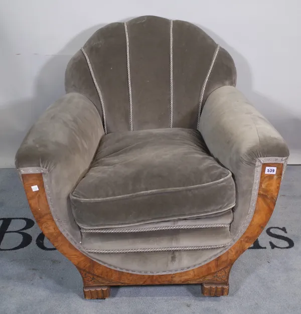 A 1930s figured walnut framed shell back armchair, 80cm wide x 79cm high.