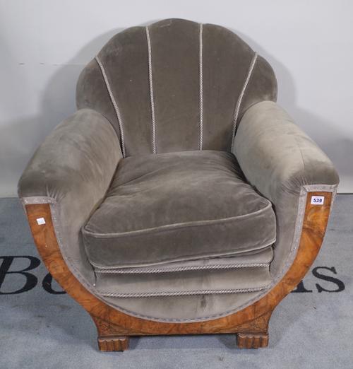 A 1930s figured walnut framed shell back armchair, 80cm wide x 79cm high.
