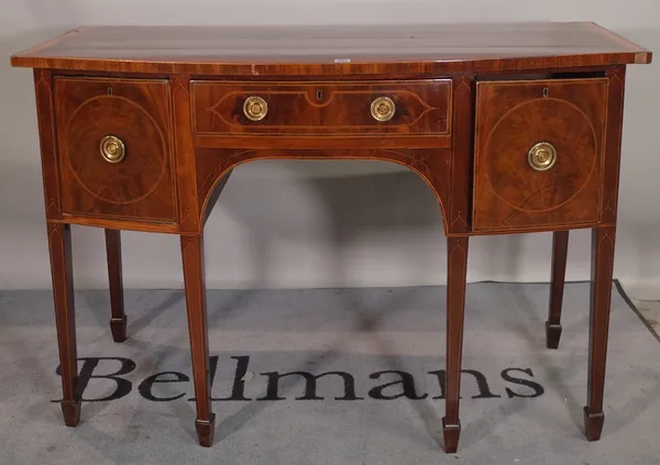 A George III mahogany and satinwood banded sideboard, on tapering supports 136cm wide x 90cm high.