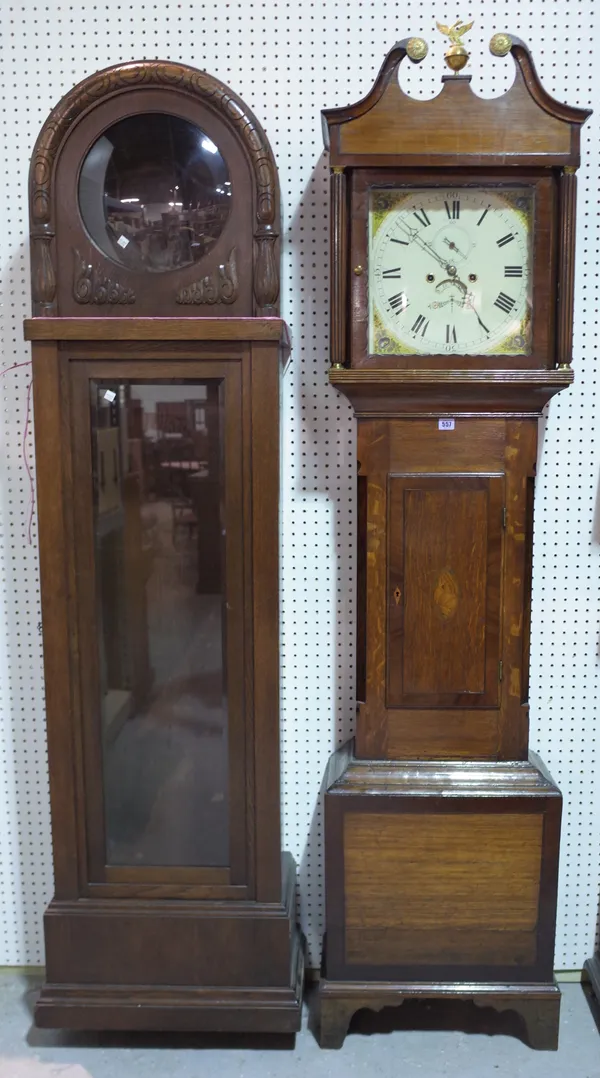 An early 20th century oak cased eight day longcase clock with painted dial, 190cm high and a 20th century oak longcase clock case, 196cm high, (2).