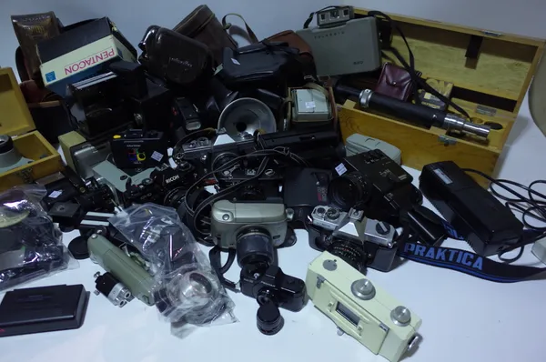A large quantity of cameras, including Poleroid, Kodak, Minolta, Pentax, lenses and accessories, (qty). Sold as seen.