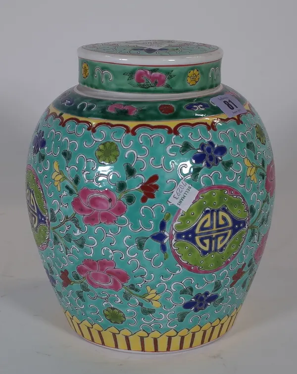 A Chinese famille-rose ovoid jar and cover, painted with flowers and shou medallions against a turquoise ground, 25cm high, (2).