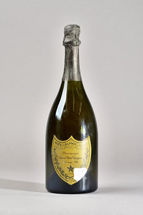 One bottle of 1982 Cuvee Dom Perignon Champagne, cased. Illustrated.