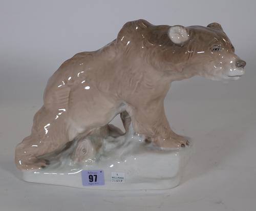 An Amphora pottery bear with 'pepperette' holes to top, 23cm high, a Bohemian ruby flask goblet engraved with flora and fauna, 12.5cm high, and two gl
