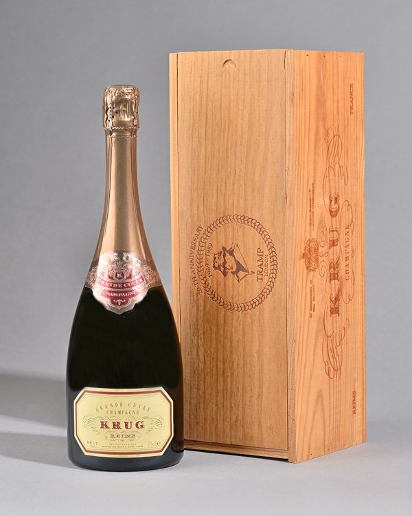 One bottle 1989 Krug champagne. Special limited edition in a stamped wooden presentation box produced for the 20th anniversary (1969-1989) of 'Tramp'