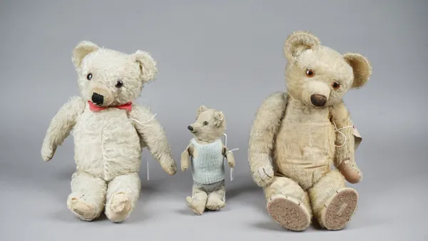 A Merrythought stuffed teddy bear, pre-war, with golden fur and jointed limbs, 50cm high, a similar Chad Valley teddy bear, 52cm high and one further