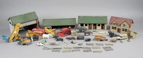 A quantity of Britains hollow cast lead figures, pre-war, mainly farmyard animals and accessories including out buildings, also several die-cast vehic