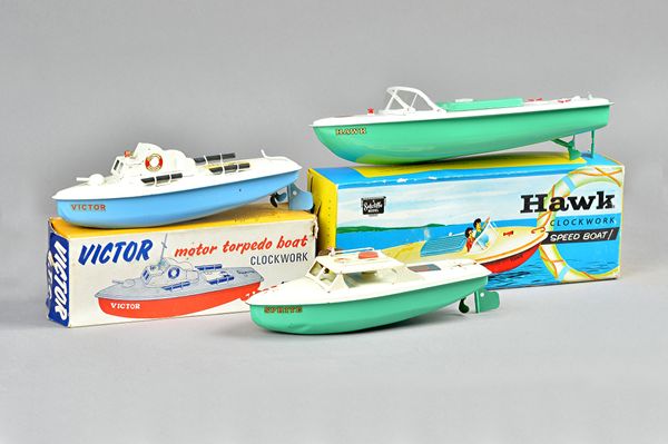 A Sutcliffe 'Hawk' clockwork tinplate speed boat, boxed, a Sutcliffe 'Motor MTB', boxed and one further Sutcliff boat plus original receipt. (3)