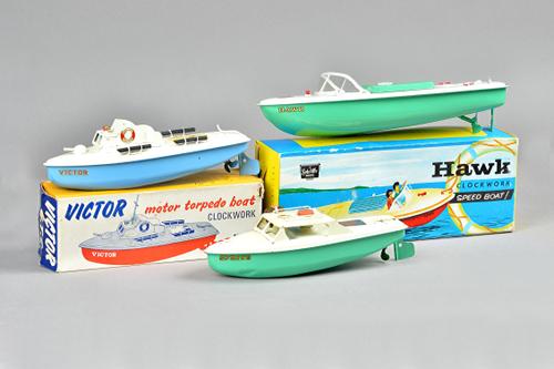 A Sutcliffe 'Hawk' clockwork tinplate speed boat, boxed, a Sutcliffe 'Motor MTB', boxed and one further Sutcliff boat plus original receipt. (3)