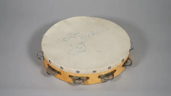 PHIL COLLINS,  AUTOGRAPHED TAMBOURINE:  a Percussion Plus tambourine, inscribed and signed in blue marker 'Lots of Love Phil Collins' and further anno