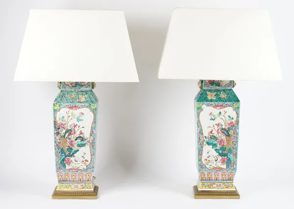 A pair of modern Chinese style famille verte vases (converted to table lamps), each decorated with flora & fauna with rectangular gilt metal mounts, v